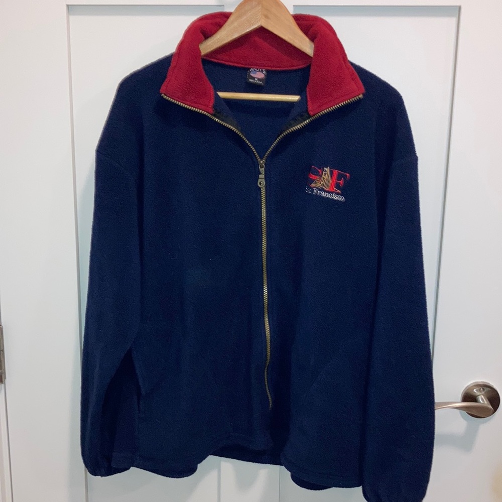 Men’s (uni-sex) blue jacket with SF San Francisco on left chest plate. Andy’s.